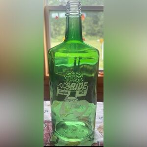 Sturgis 75th Anniversary Green Glass Bottle with Ride Design